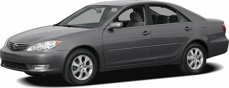 Front side view of gray mid-size sedan with alloy wheels