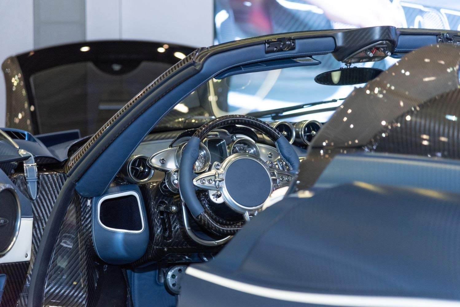 Luxury roadster interior with carbon fiber and detailed dashboard