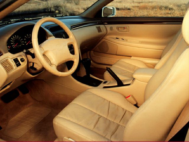 Beige leather interior with dashboard and steering wheel details