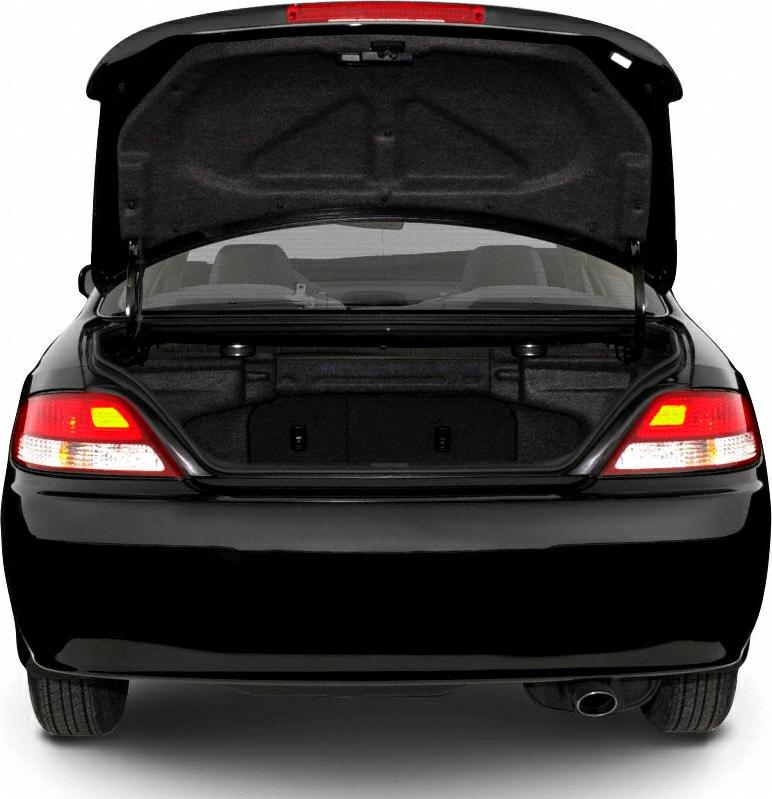 Rear view with open trunk and illuminated taillights