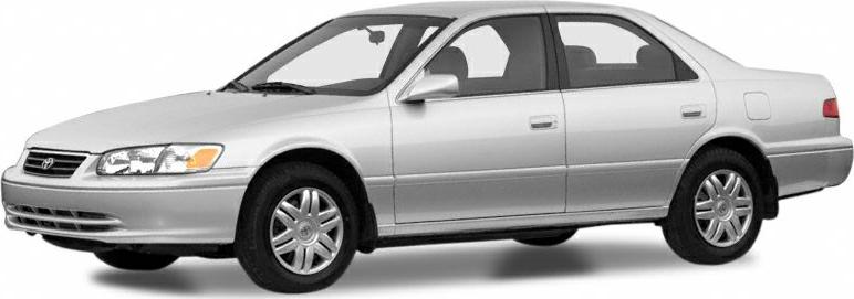 Silver sedan front side view with classic 2000s headlamps and alloy wheels