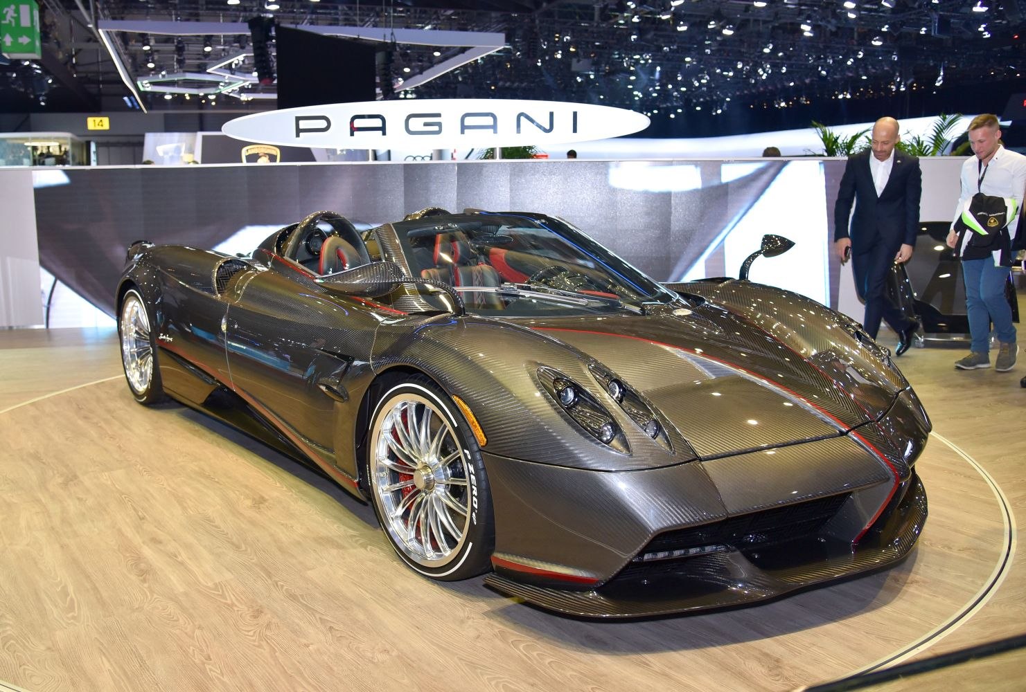 Carbon fiber supercar front with detailed headlights and alloy wheels