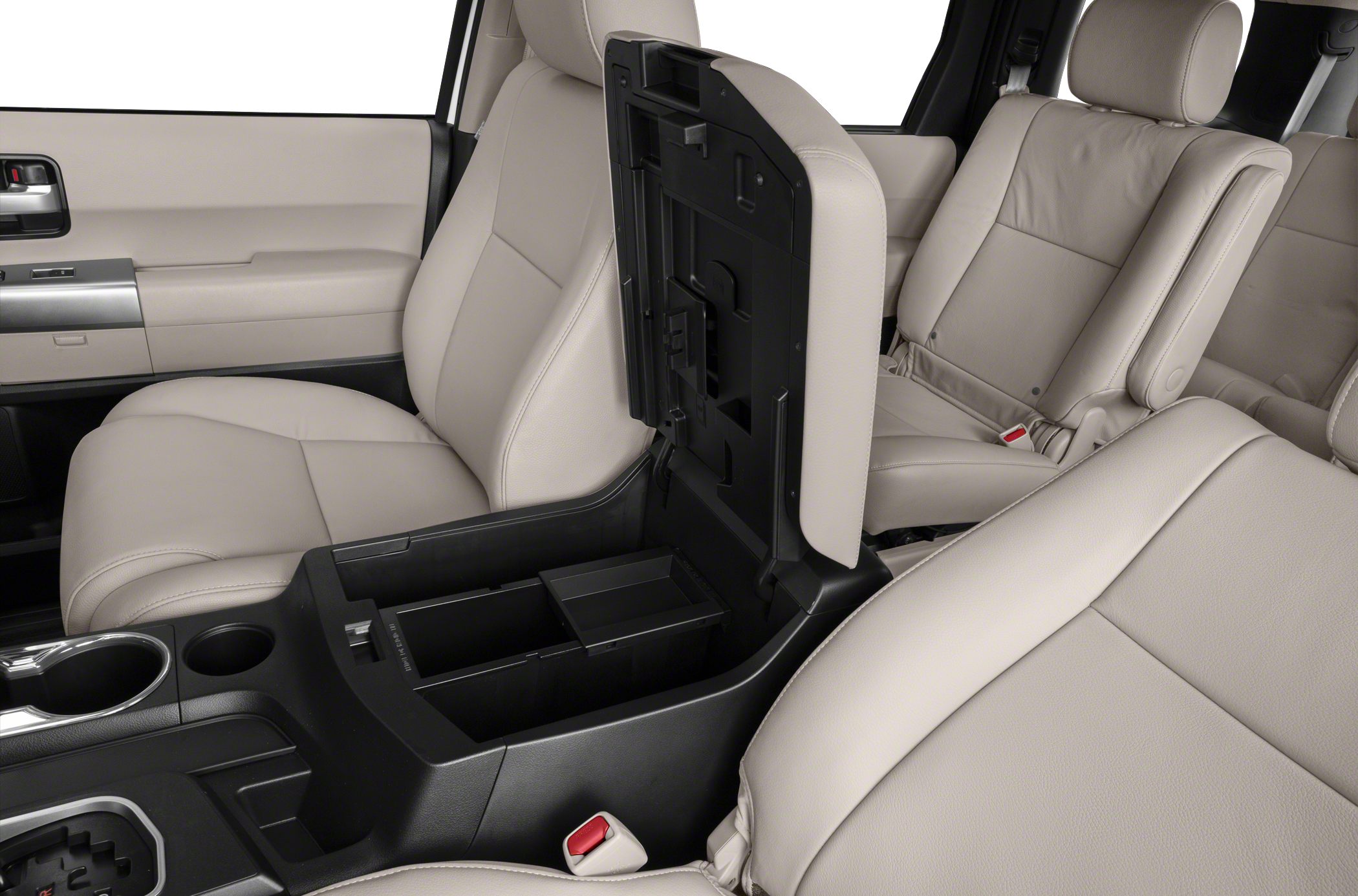 Open center console storage with beige leather seats in spacious SUV interior