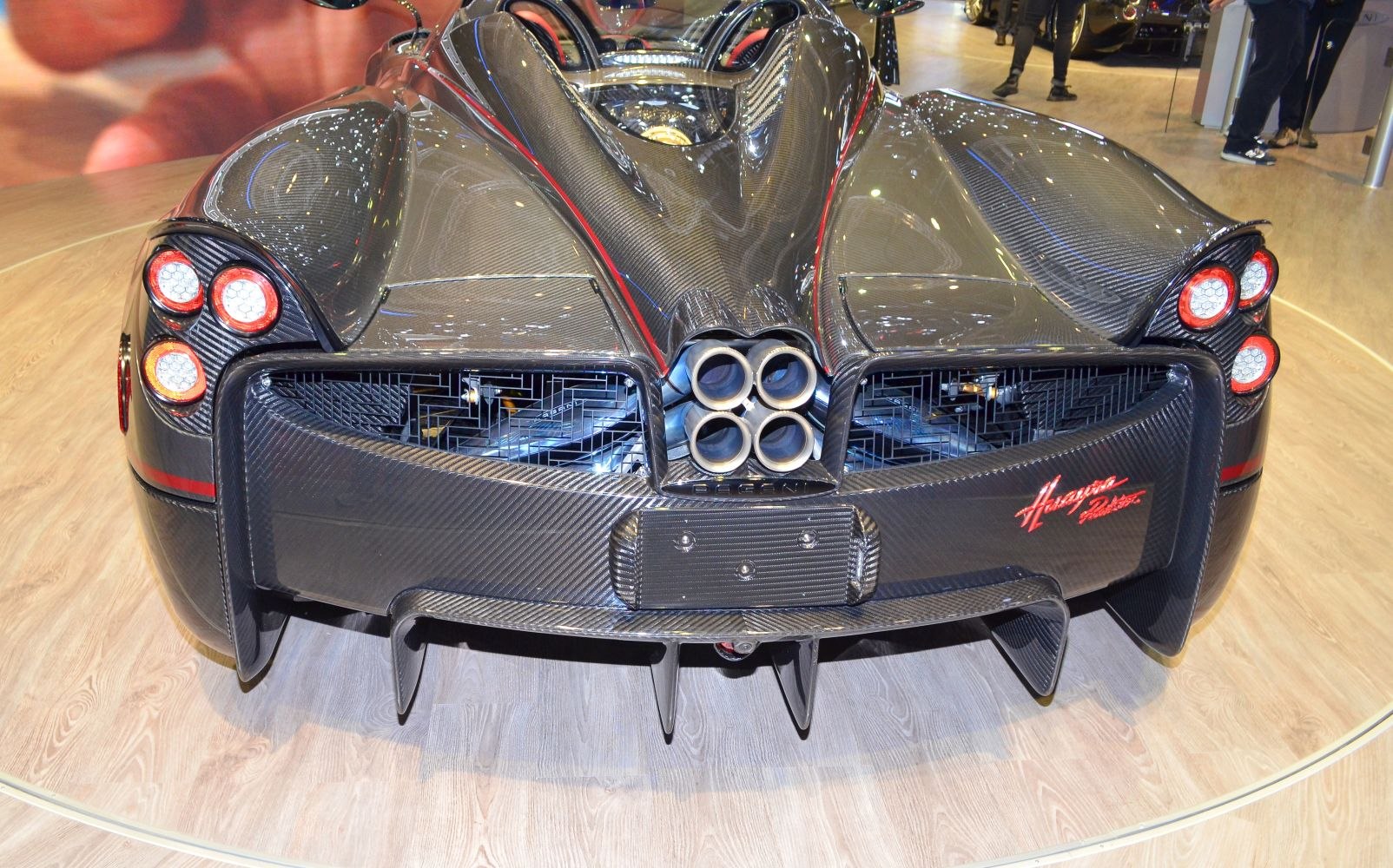 Rear view with quad exhaust and carbon fiber body detailing