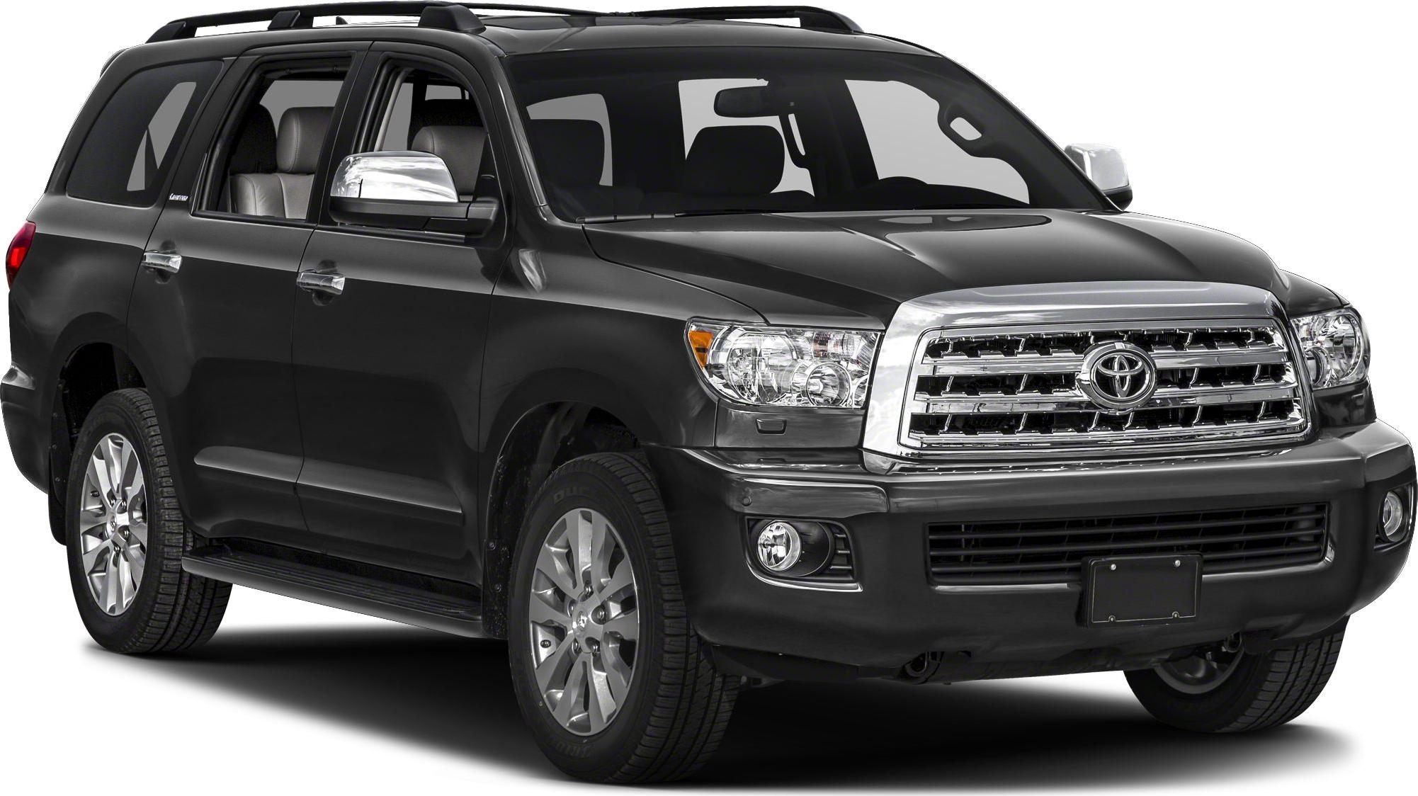 Large SUV with chrome grille, roof rails, and multi-spoke wheels