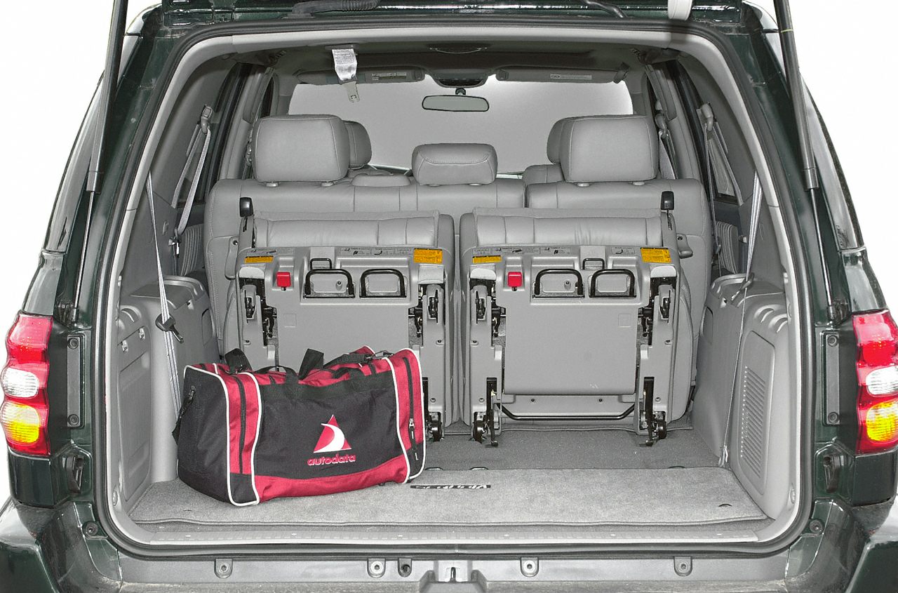 SUV rear cargo area with foldable rear seats and duffel bag