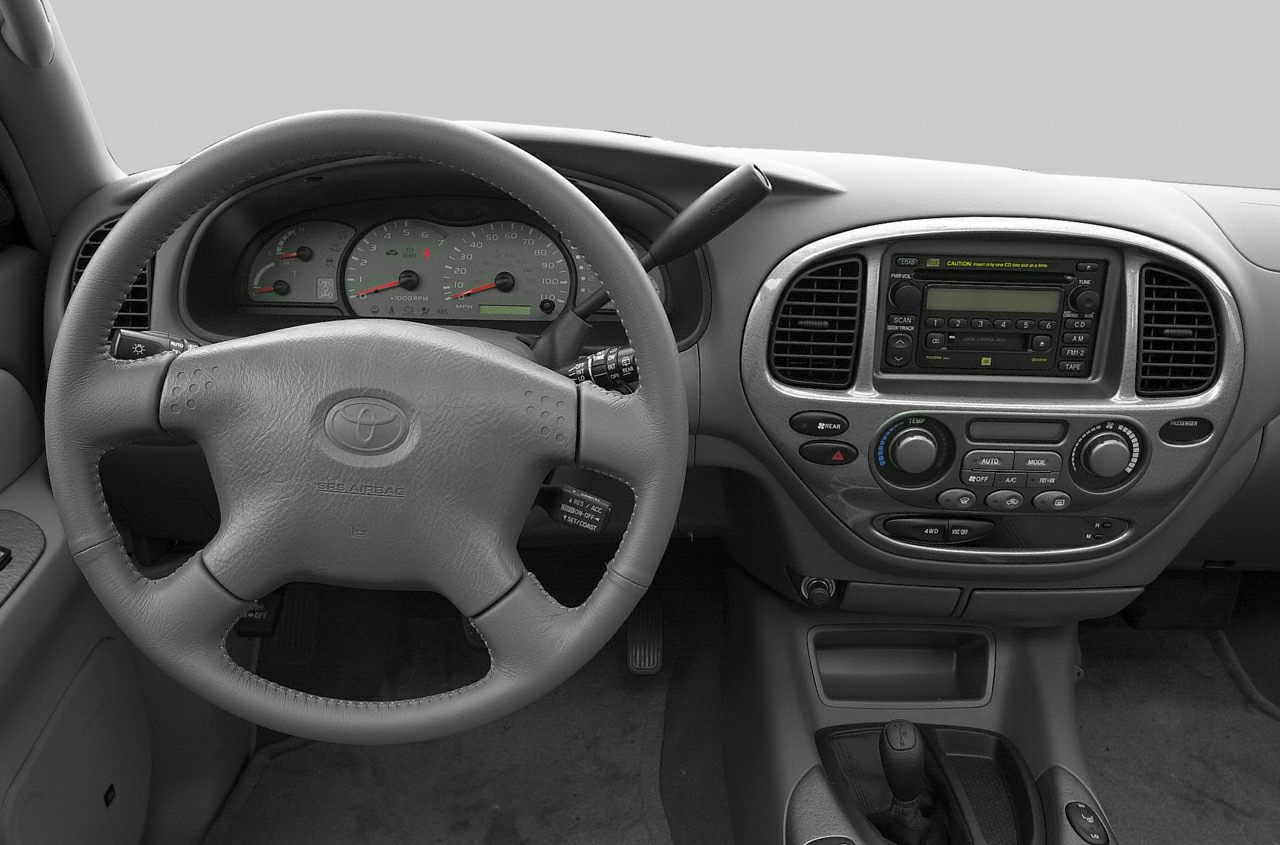 Dashboard and steering wheel with control panel and gauges