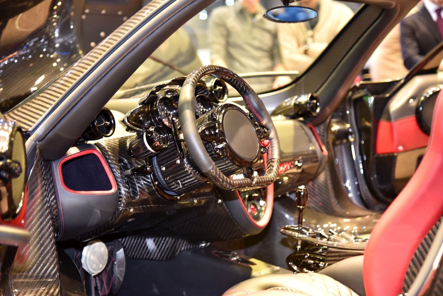 Carbon fiber interior with custom steering wheel and red accents