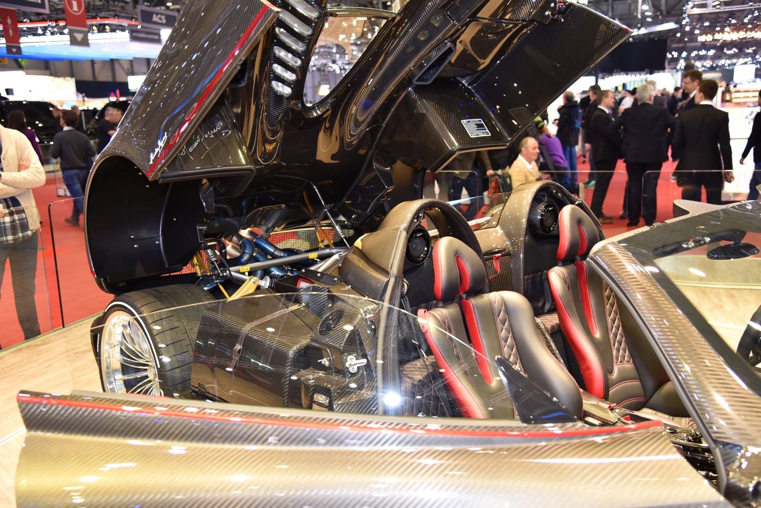 Carbon fiber rear engine bay and sporty two-tone bucket seats