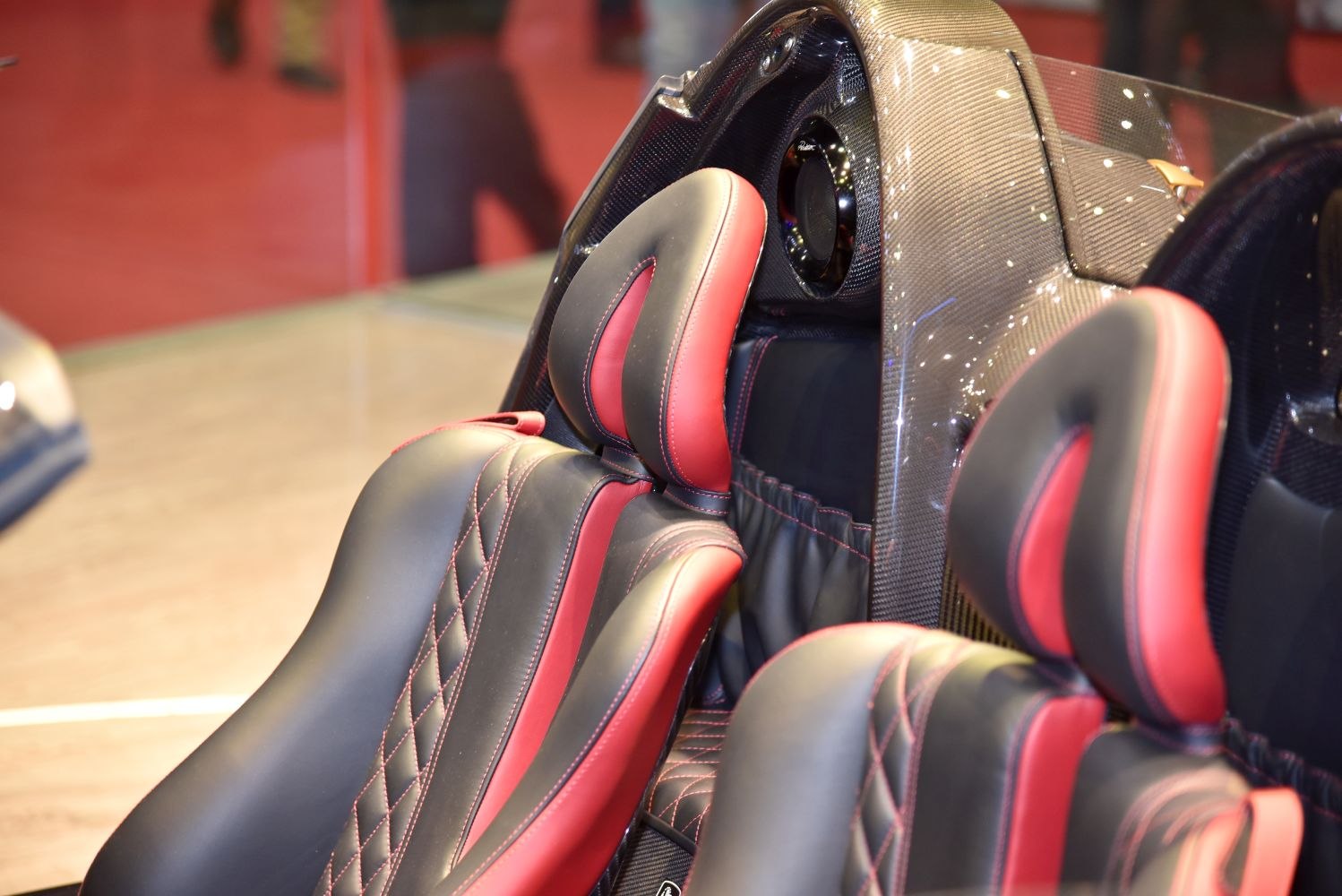 Luxury carbon fiber panel with black and red leather sport seats