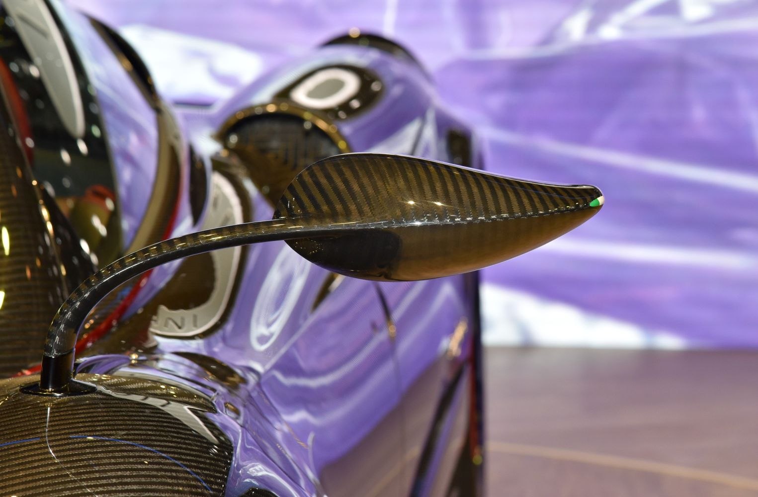 Aerodynamic carbon fiber side mirror with sleek, curved design