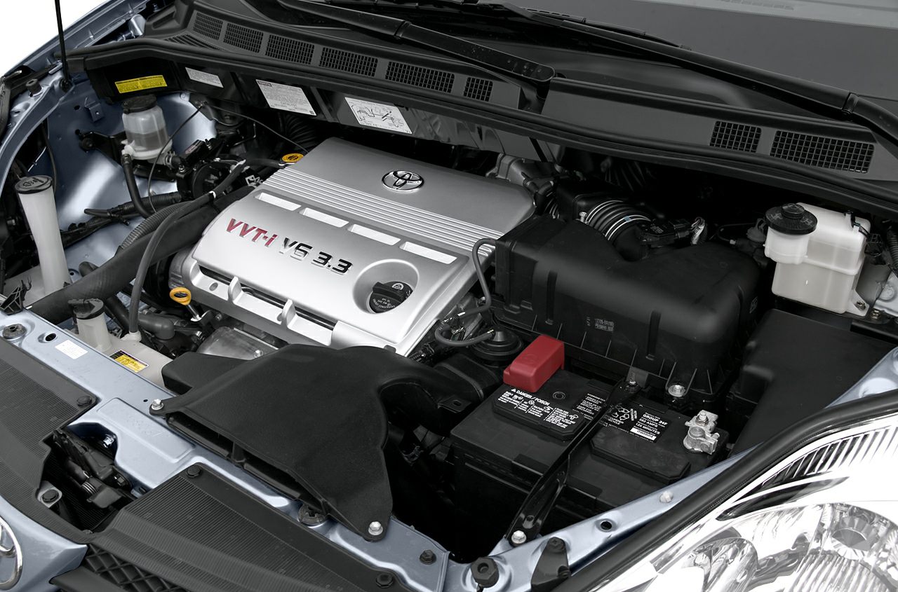 Close-up of 3.3 V6 VVT-i engine bay with battery and fluid reservoirs