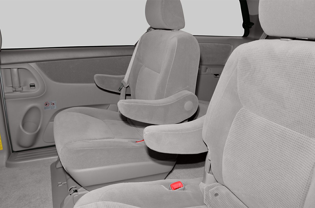 Cloth-upholstered passenger seats with armrests in minivan interior