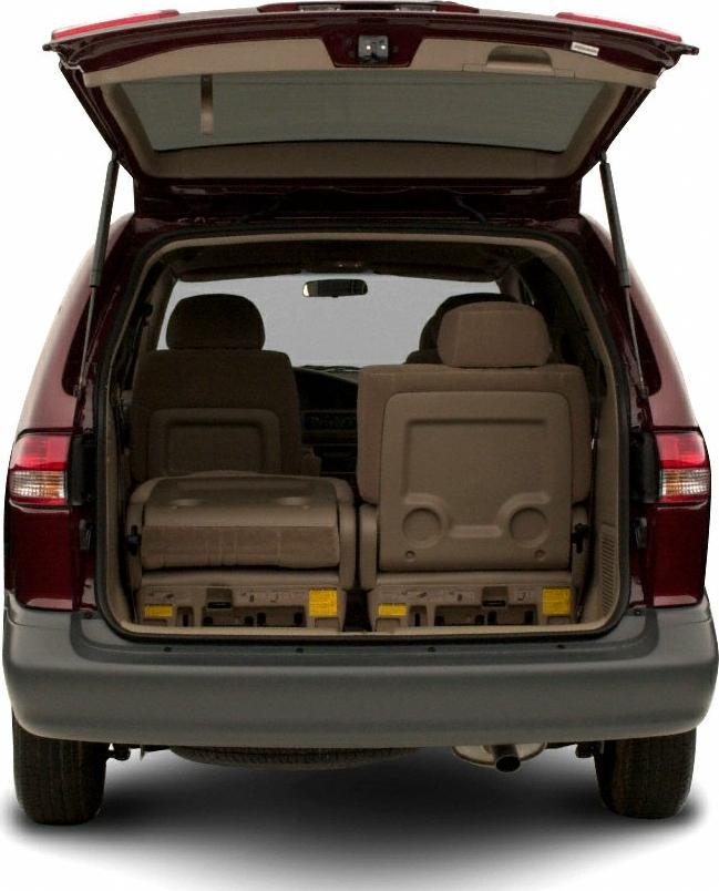 Open tailgate with folded rear seats and visible spacious interior of a minivan.