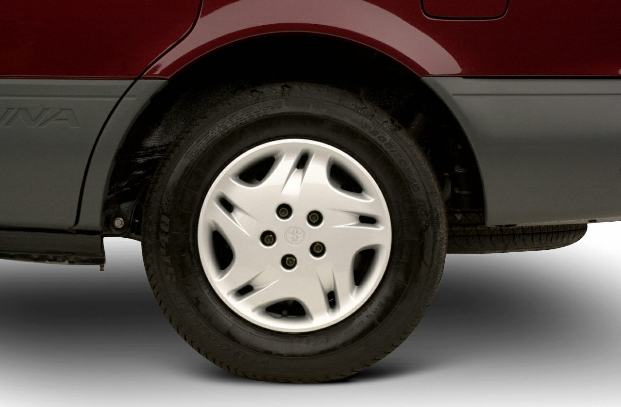 Rear wheel, tire with hubcap and body side panel