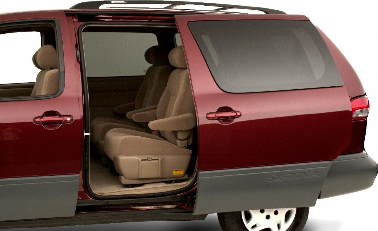 Sliding minivan door open showing beige interior seats
