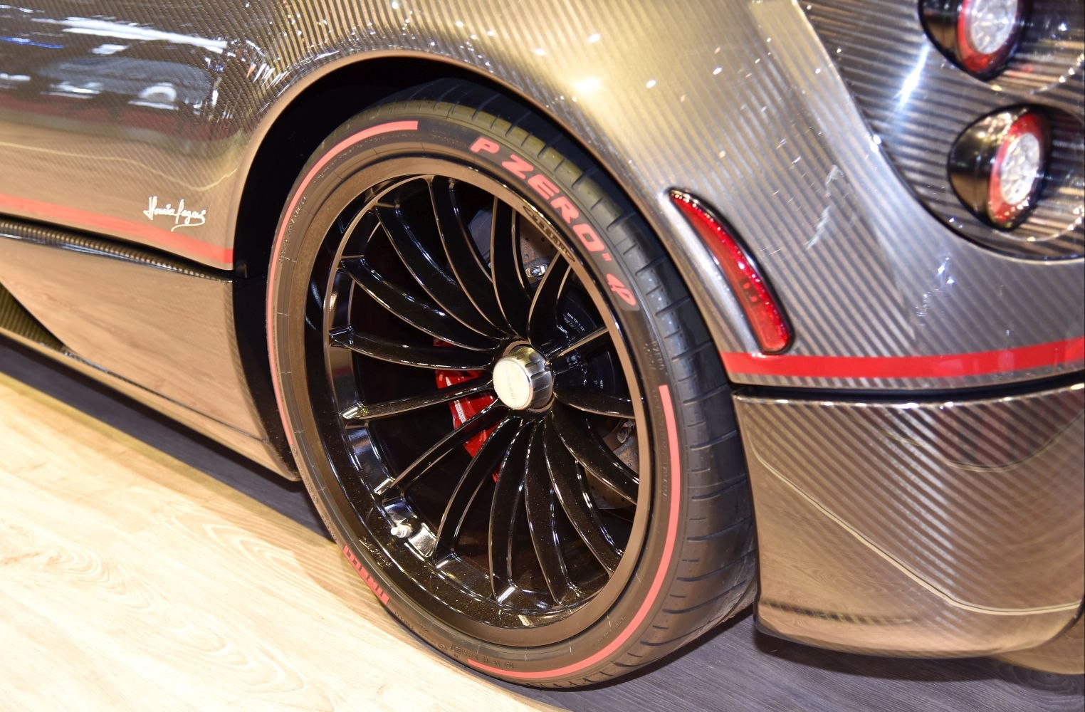 Carbon fiber rear panel and black alloy wheel with performance tire