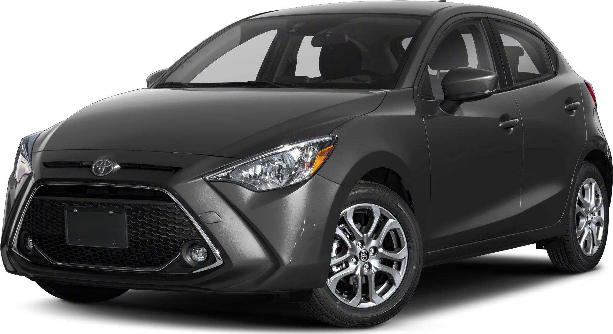 Front view with sharp headlights and large hexagonal grille