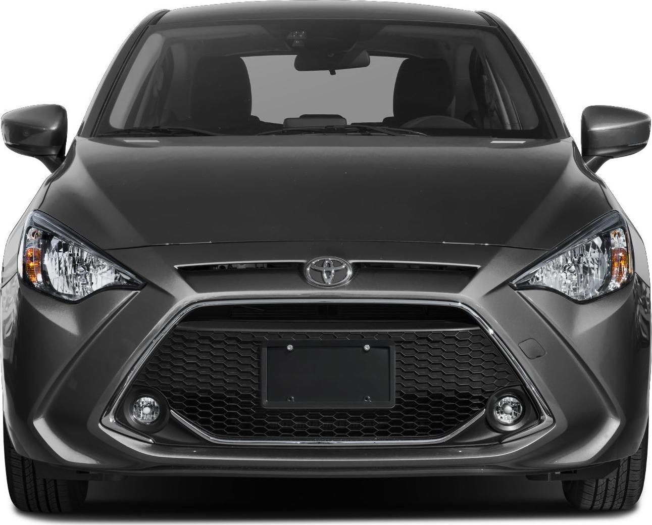 Honeycomb hexagonal grille with sharp headlights and fog lights.