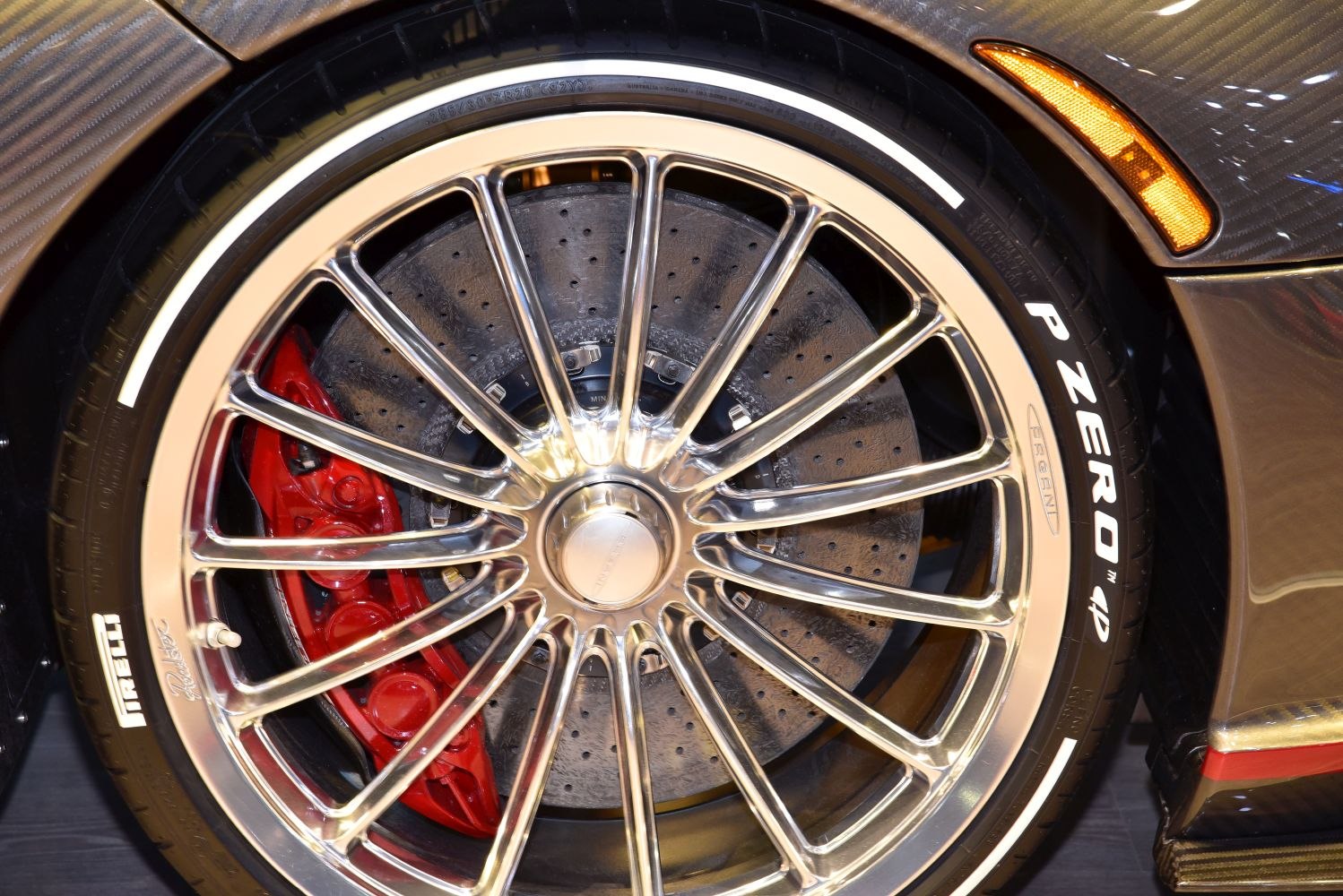 Multi-spoke alloy wheel with Pirelli P Zero tire and red brake caliper