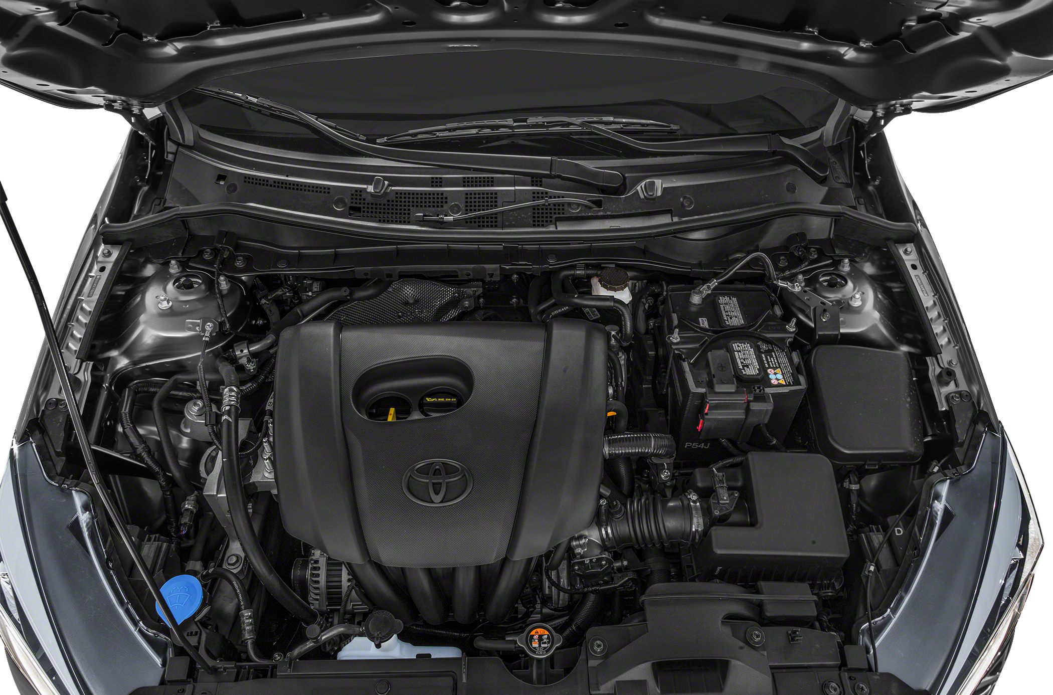 Compact Toyota engine compartment showing engine cover with logo and components