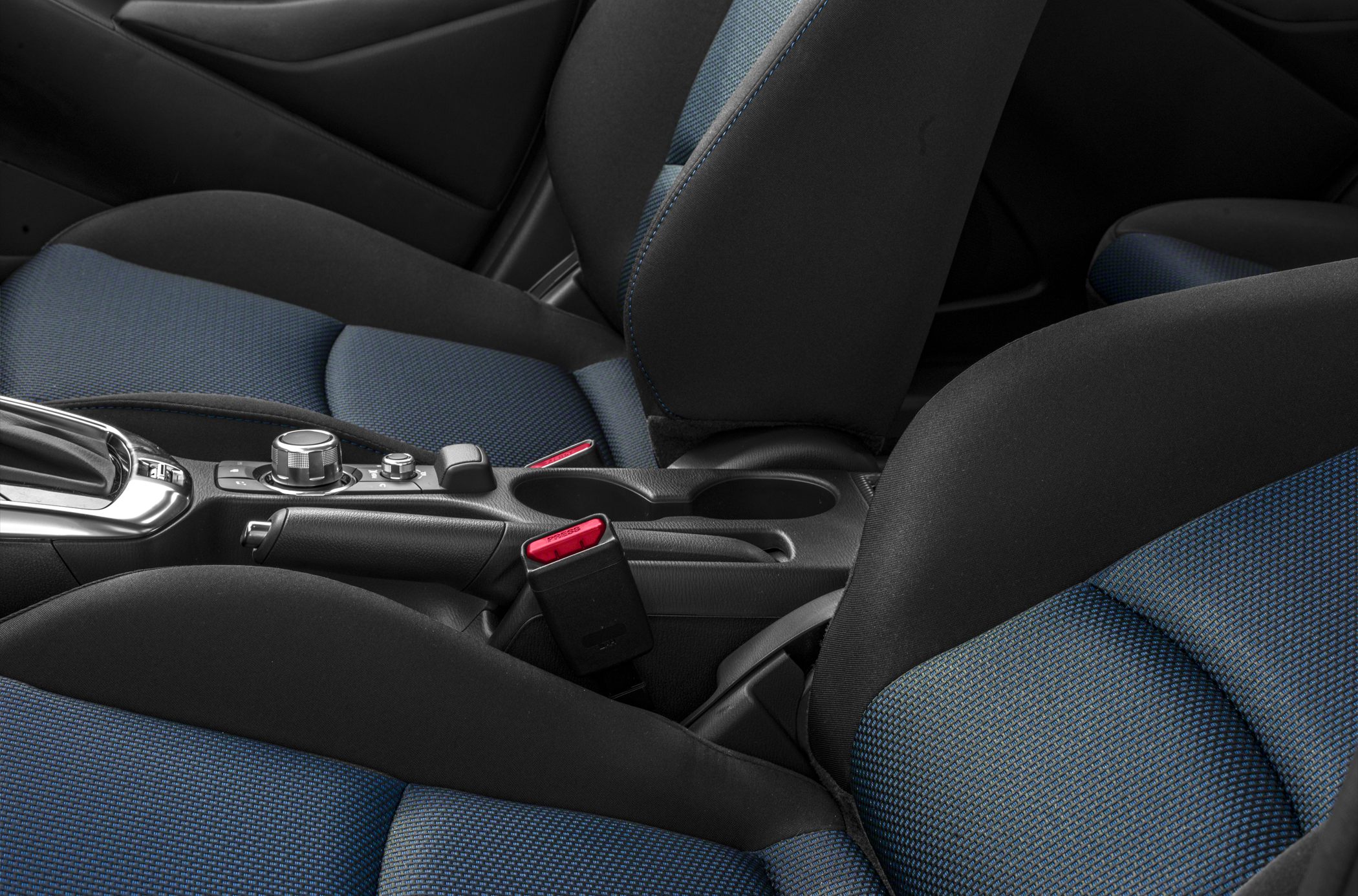 Center console with controls and blue-accented fabric seats