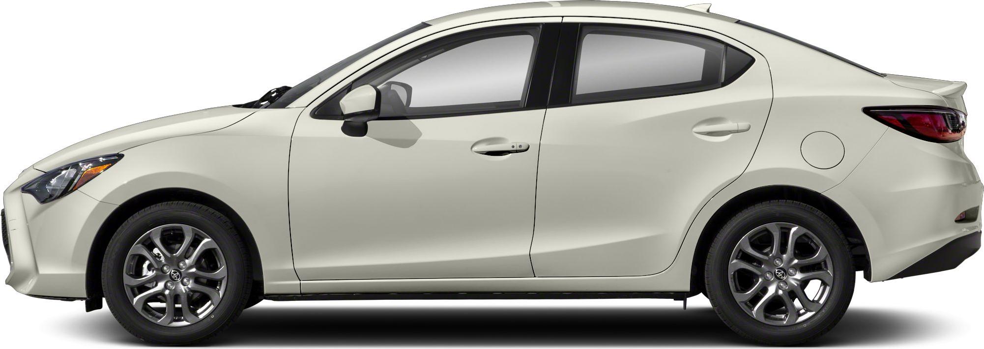 Side profile of a compact sedan with alloy wheels and a rear spoiler