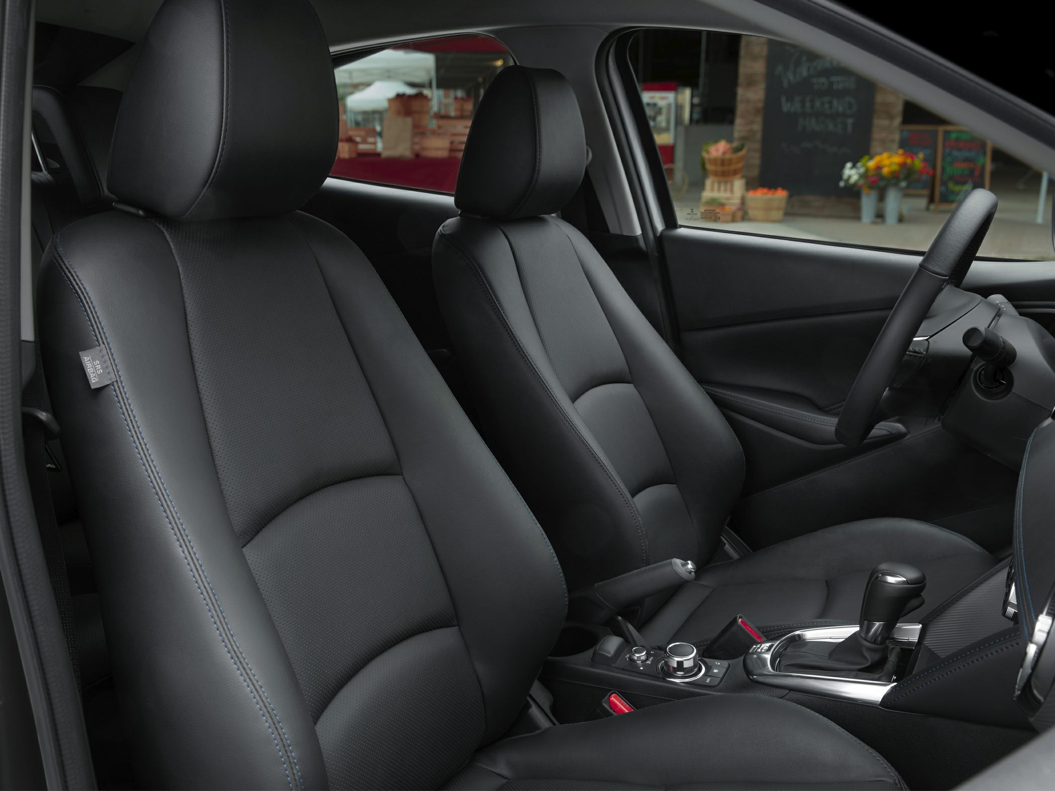 Black leather front seats with gear shift and control knob