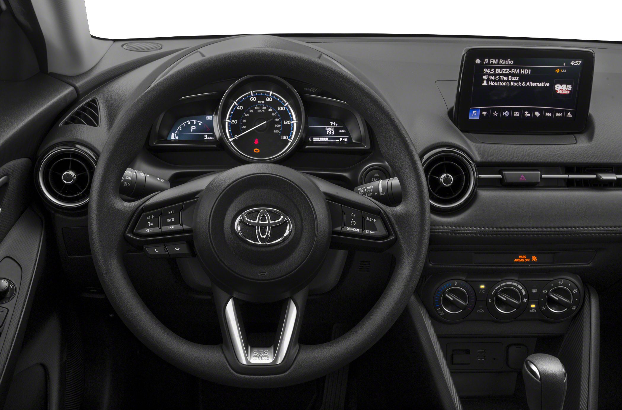 Dashboard and steering wheel with digital displays and infotainment screen