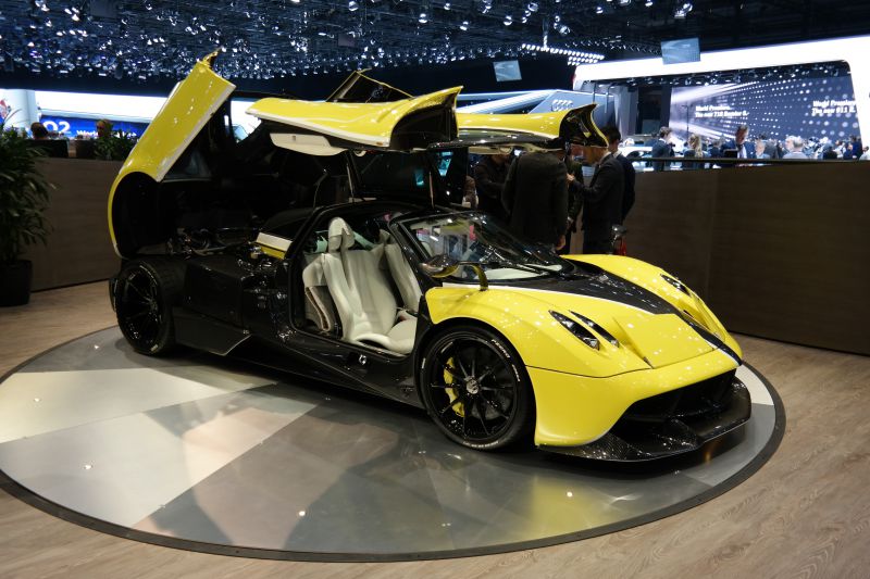 Supercar with distinctive gull-wing doors and aerodynamic body design