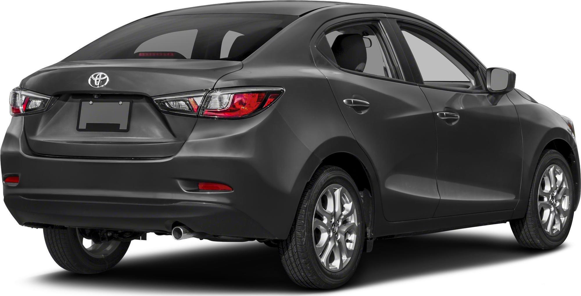 Rear three-quarter view of a compact sedan with alloy wheels and tail lights