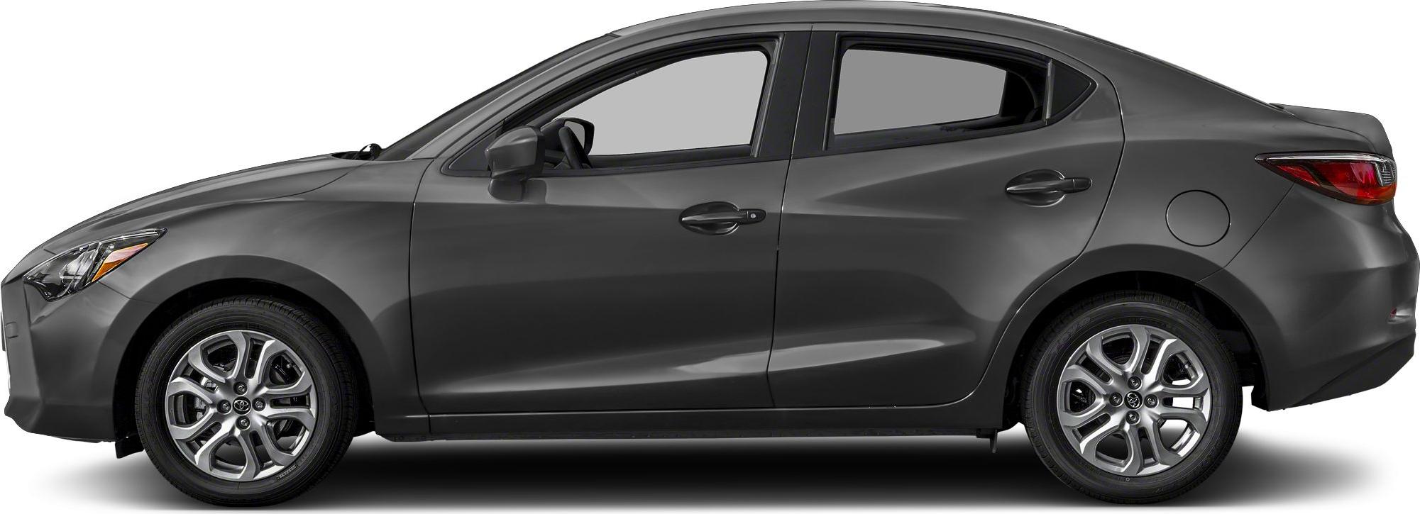 Side profile of compact sedan with alloy wheels and tinted windows