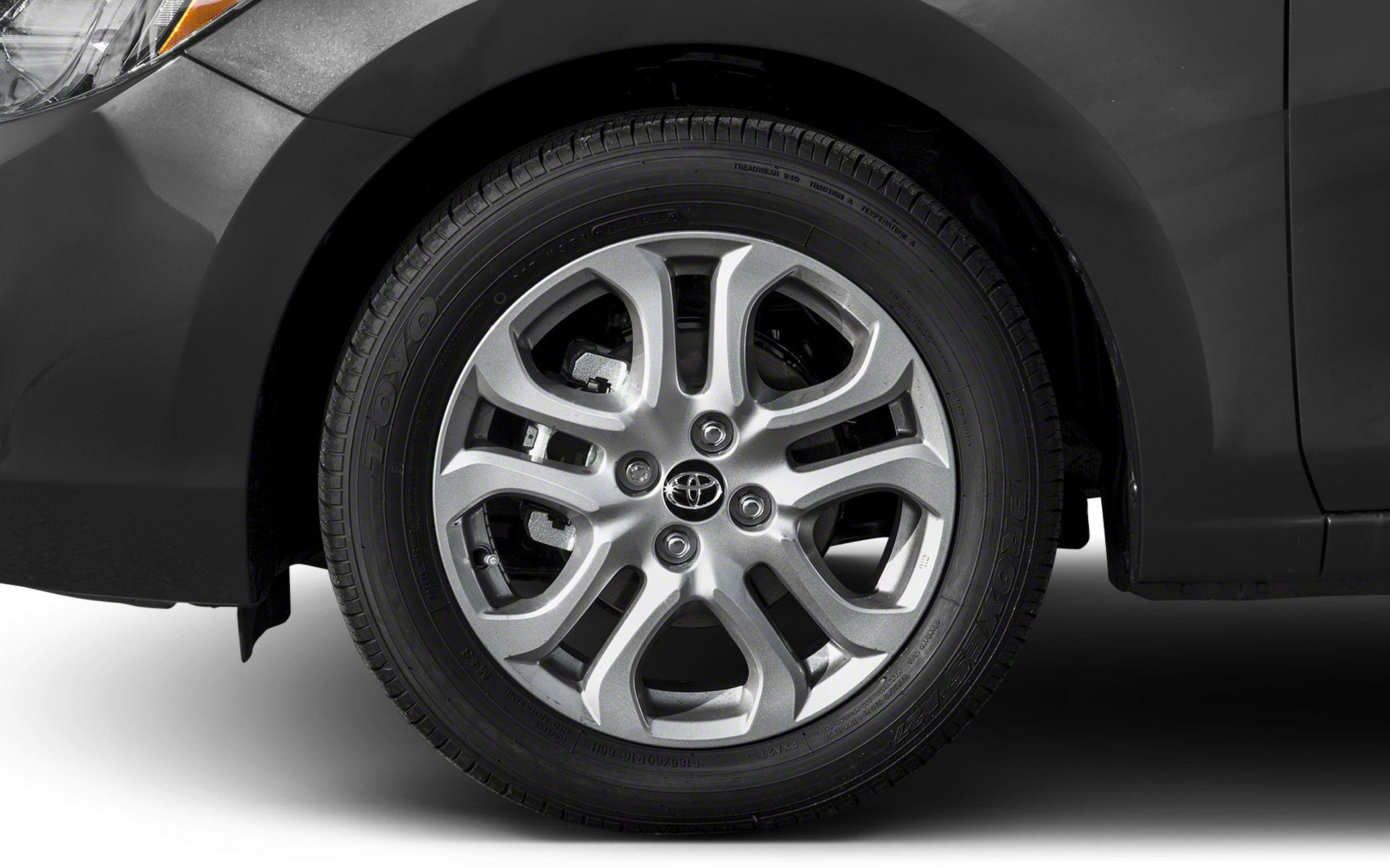 Close-up of alloy wheel and tire with Toyota emblem