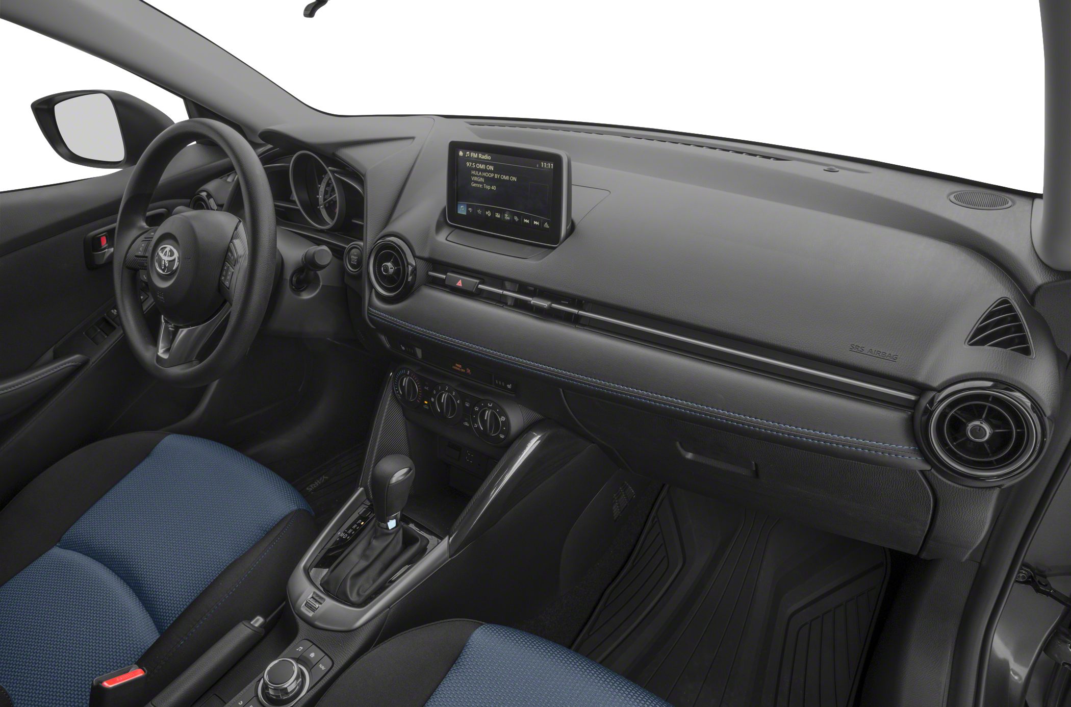 Dashboard with touchscreen, steering wheel, gear shifter in a compact car interior