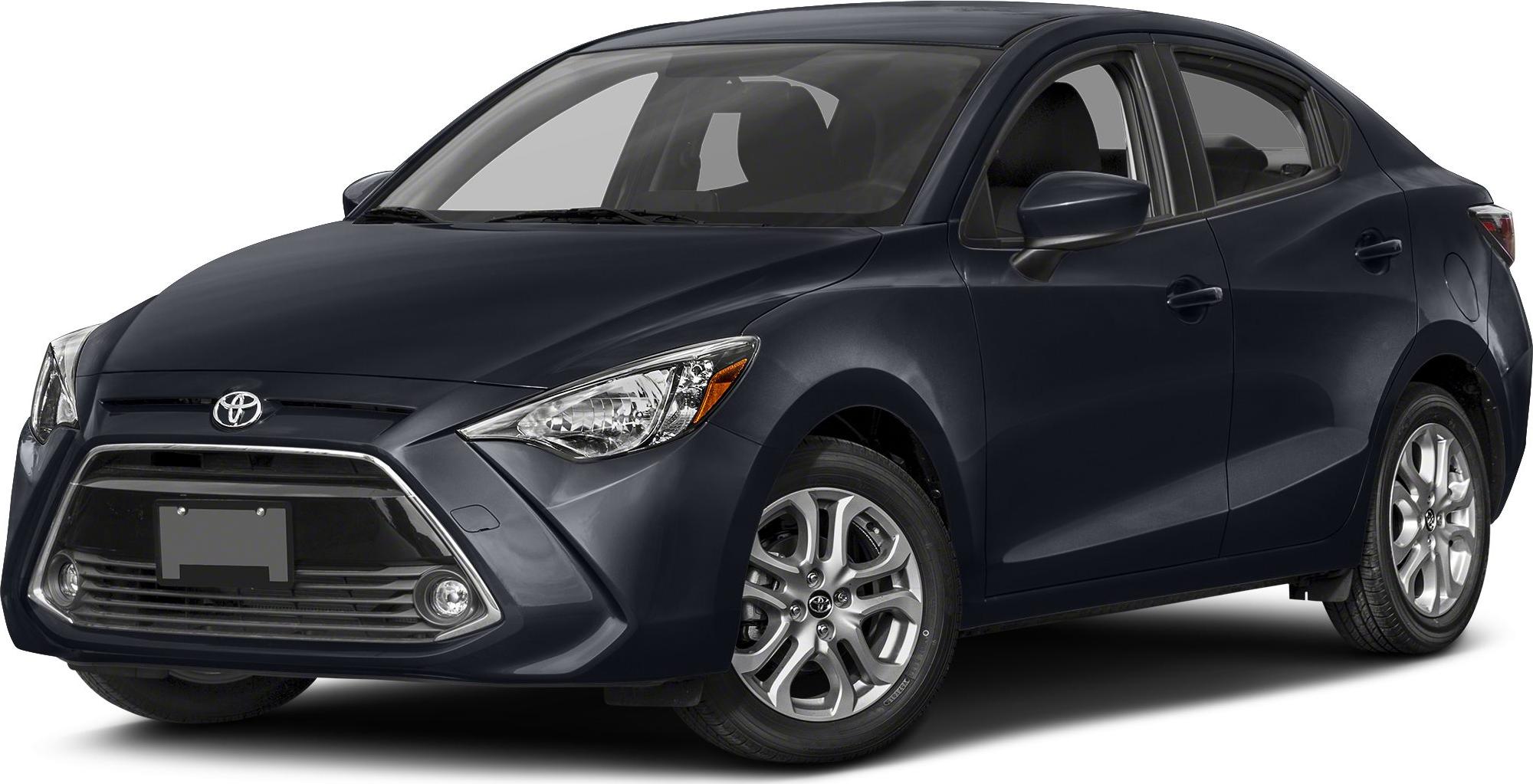 Compact sedan front view with bold grille and sleek headlights