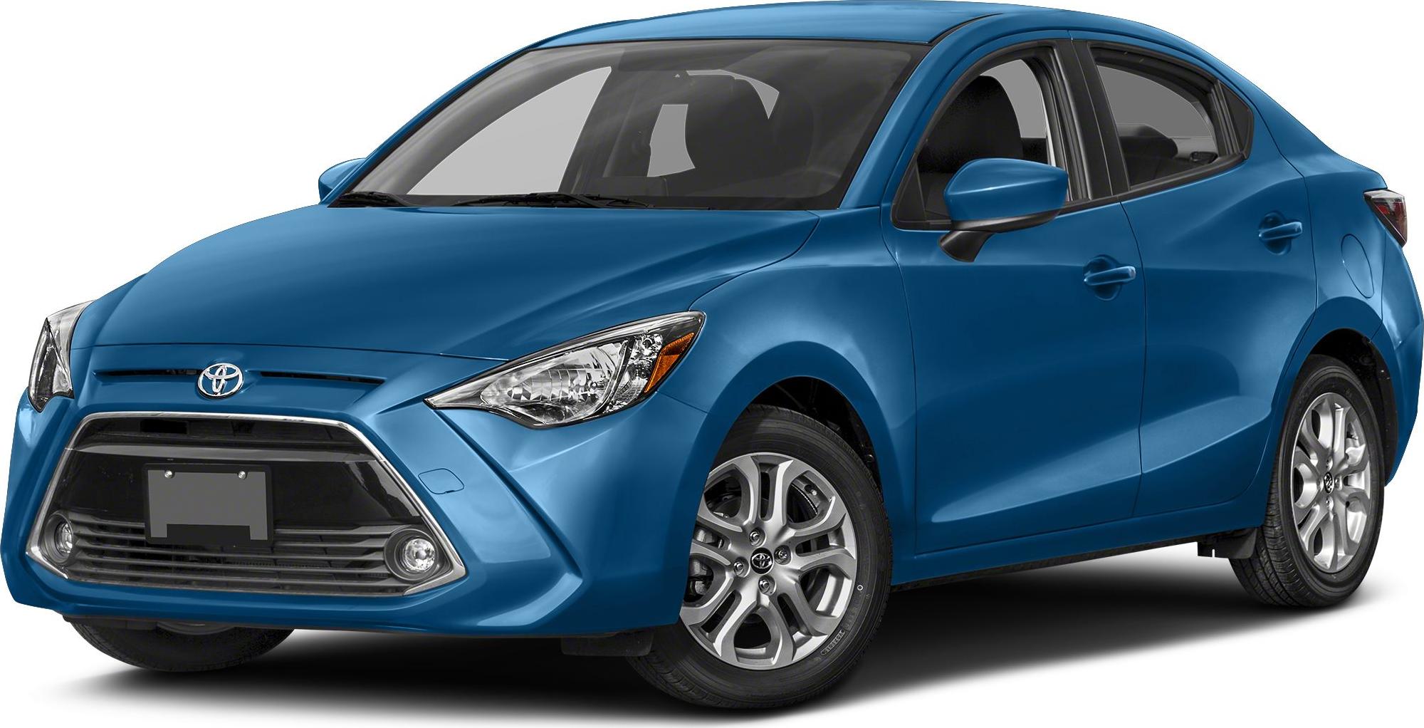 Front-side angle of a blue compact sedan with sharp headlights and unique grille