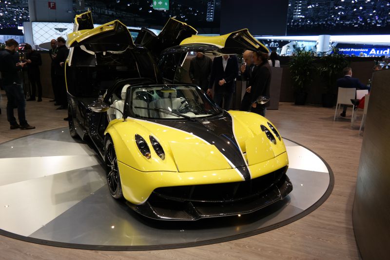 Yellow supercar with carbon fiber details and gullwing doors
