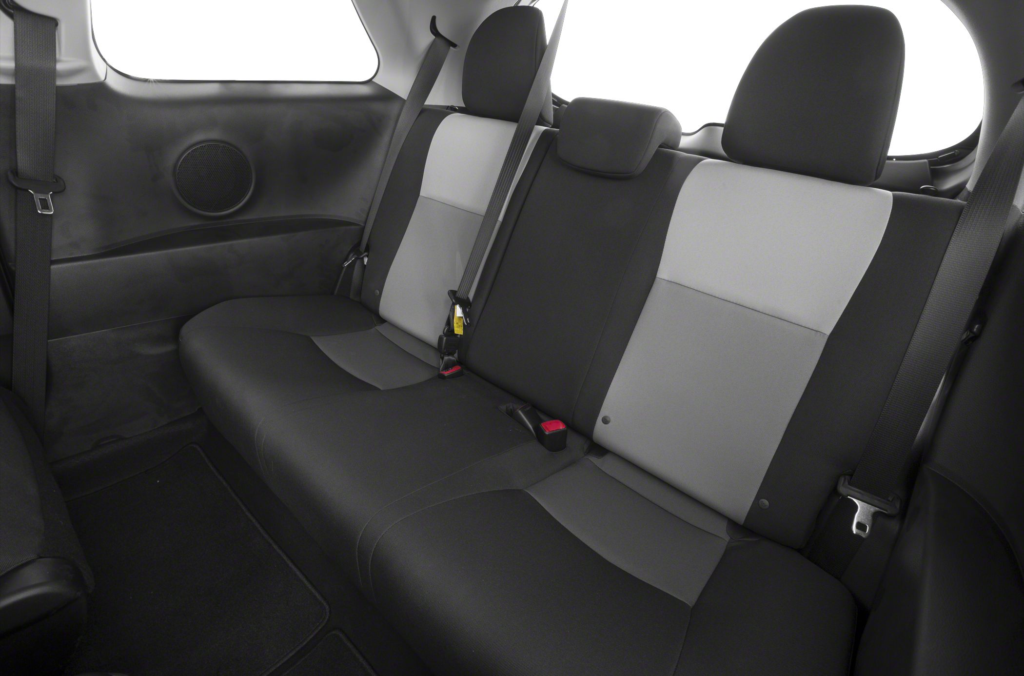 Rear seat interior with two-tone upholstery and seatbelts