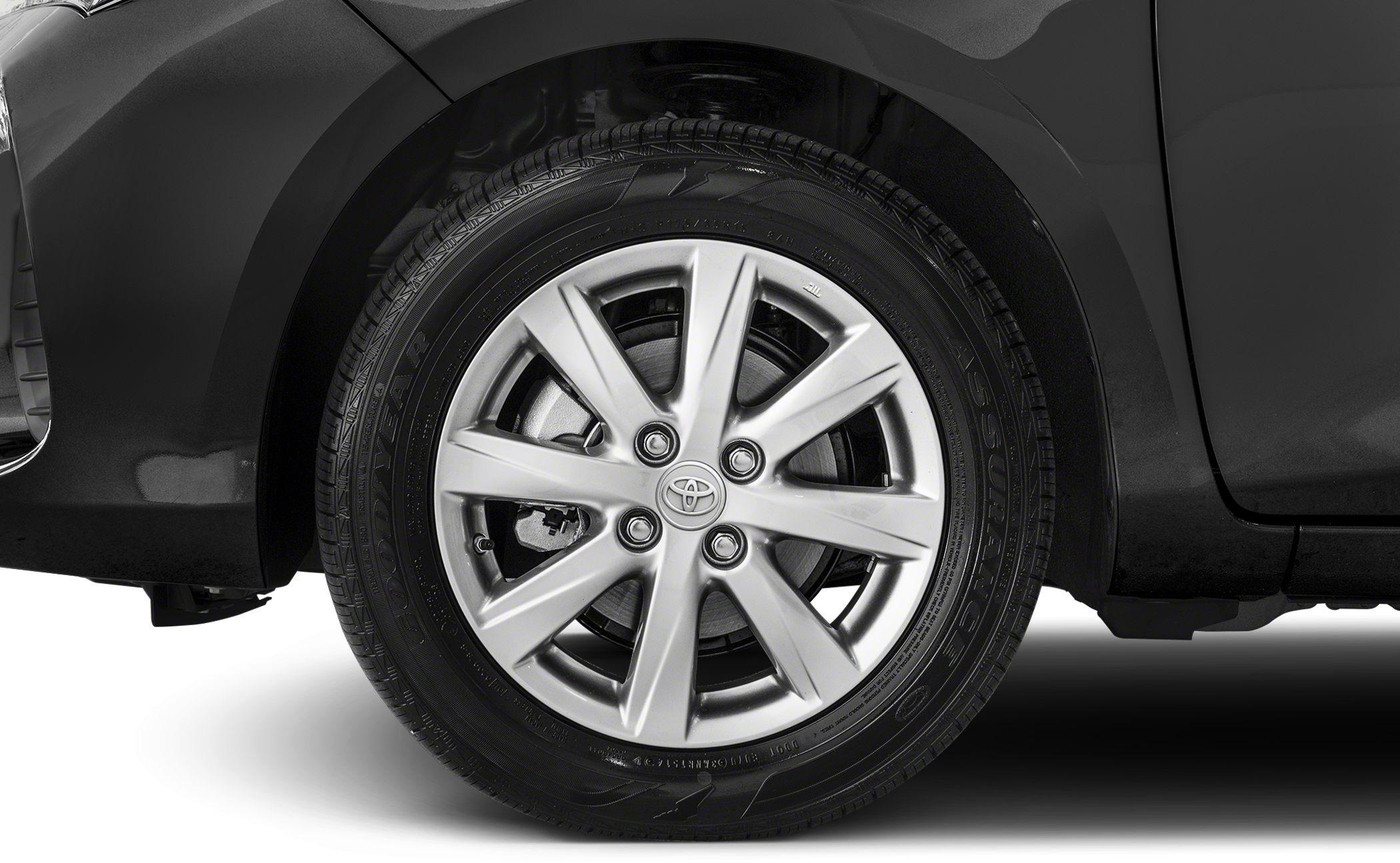 Multi-spoke alloy wheel with visible brake disc on a compact hatchback