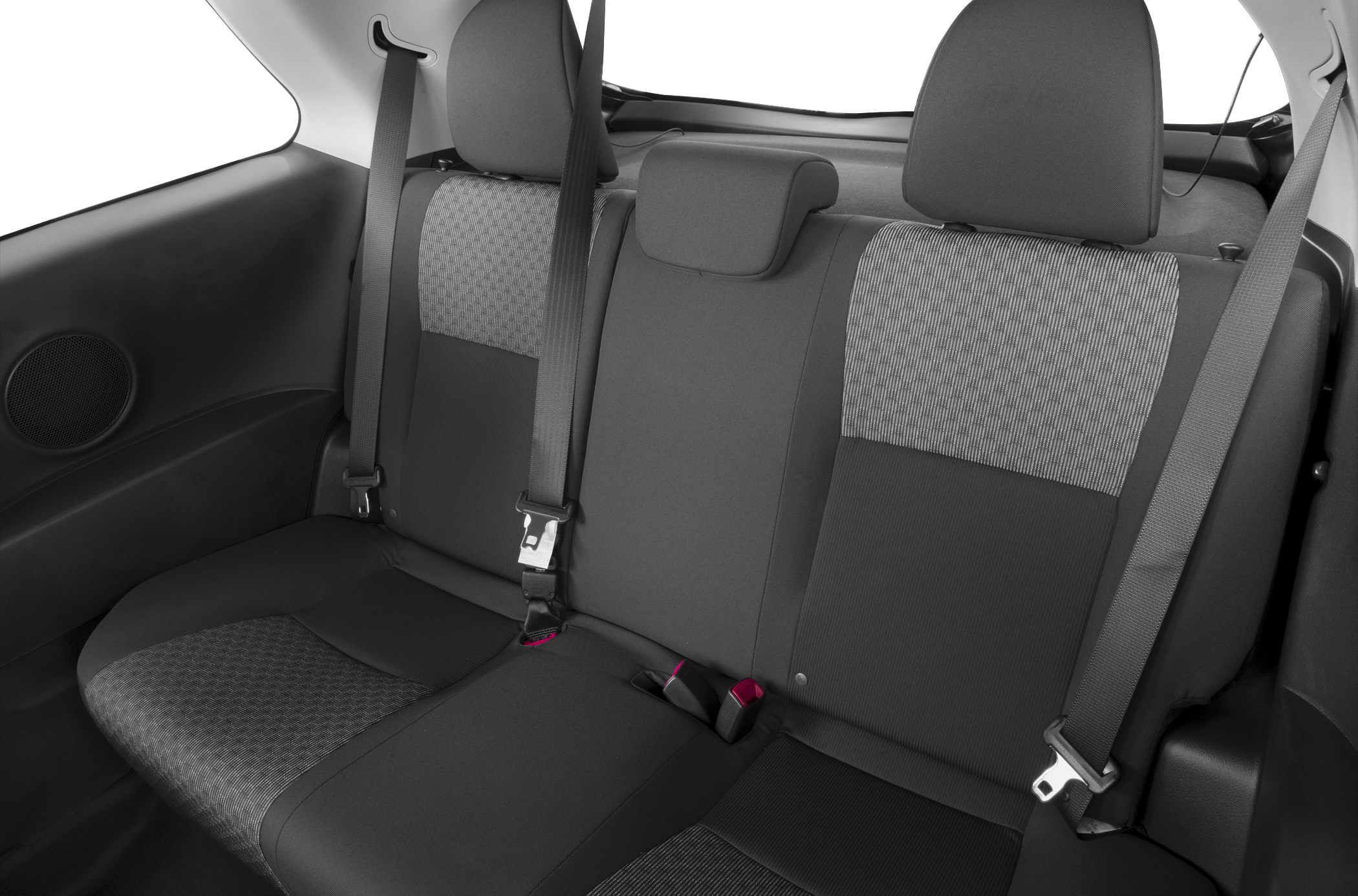 Rear seat upholstery and seat belts of a compact car interior