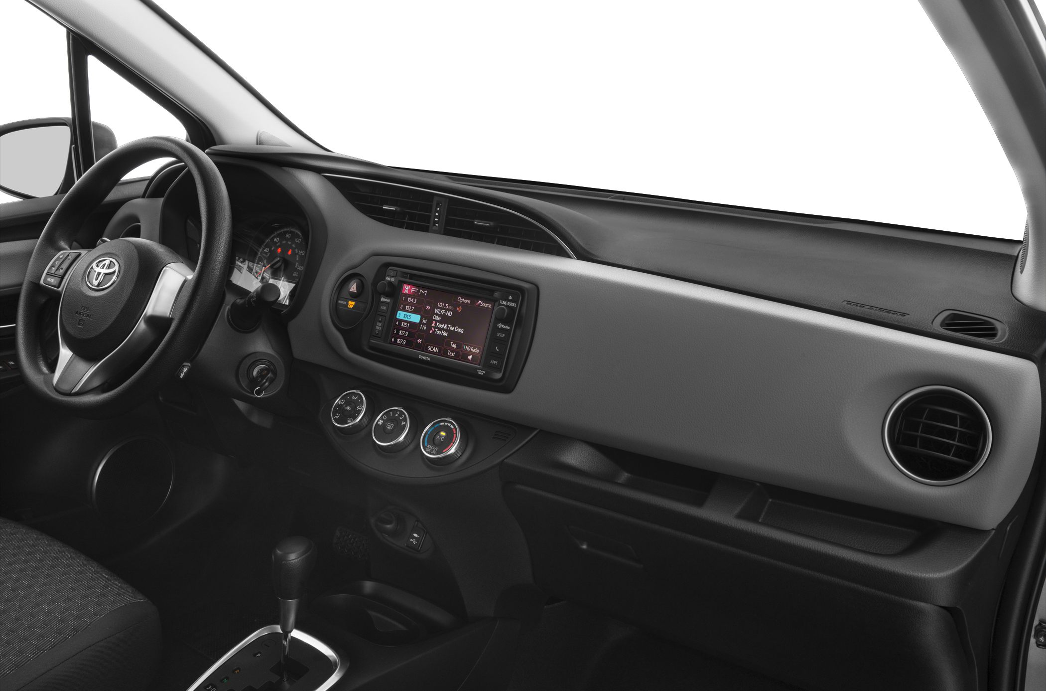 Dashboard with touchscreen, steering wheel, and circular air vents