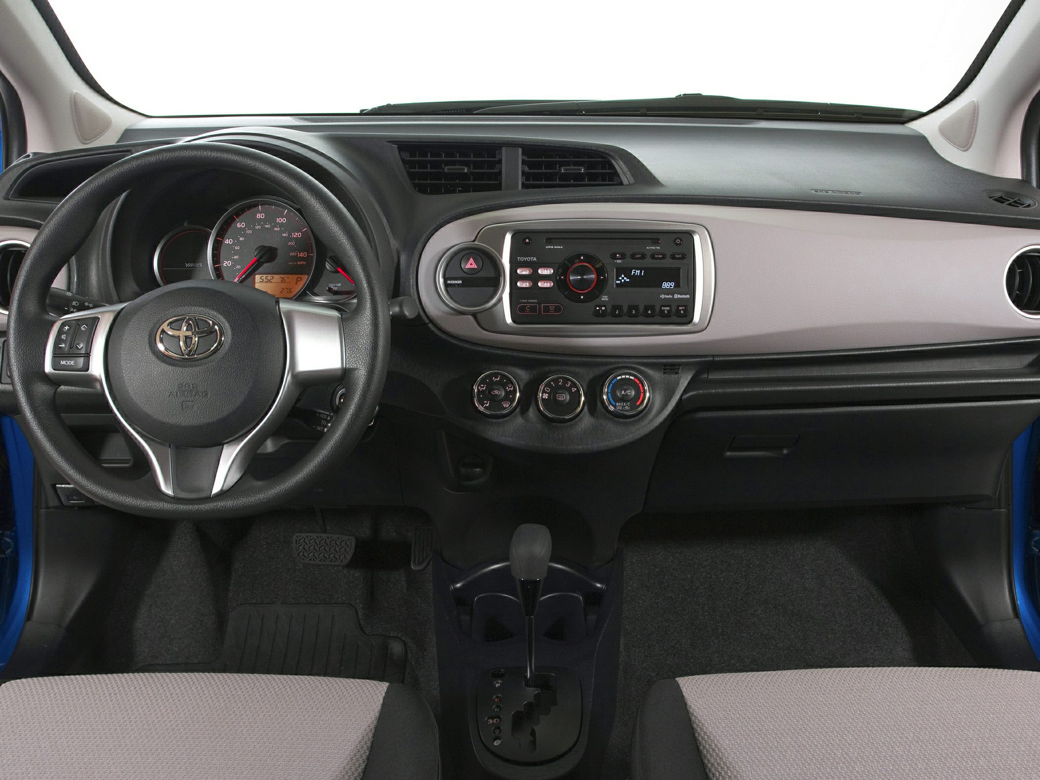 Compact car dashboard with steering wheel and central control panel