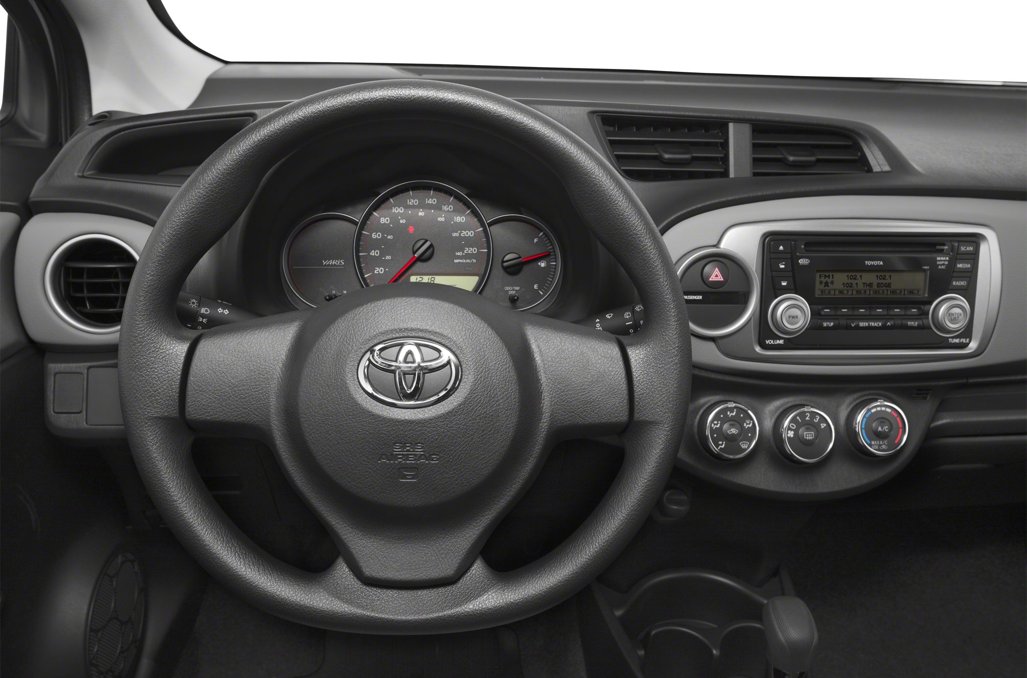Steering wheel and dashboard with instrument cluster and climate controls
