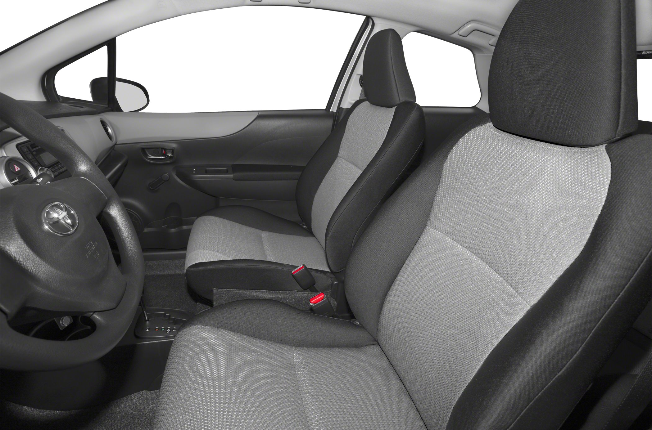 Fabric front seats and steering wheel with manual window crank in compact car interior