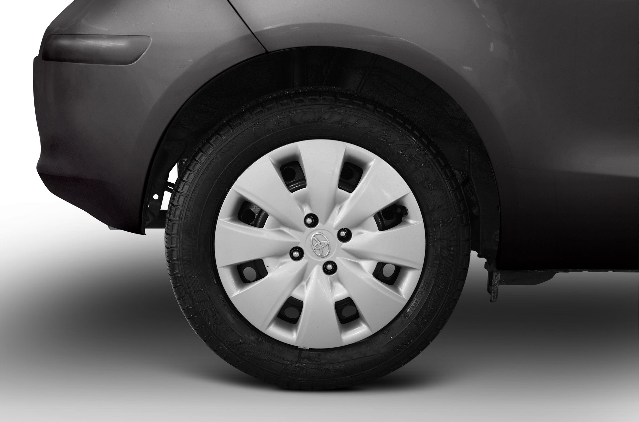 Steel wheel with hubcap and tire close-up
