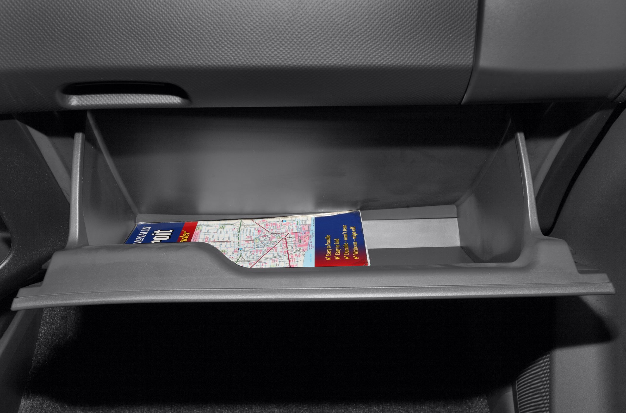 Open glove compartment with a map inside