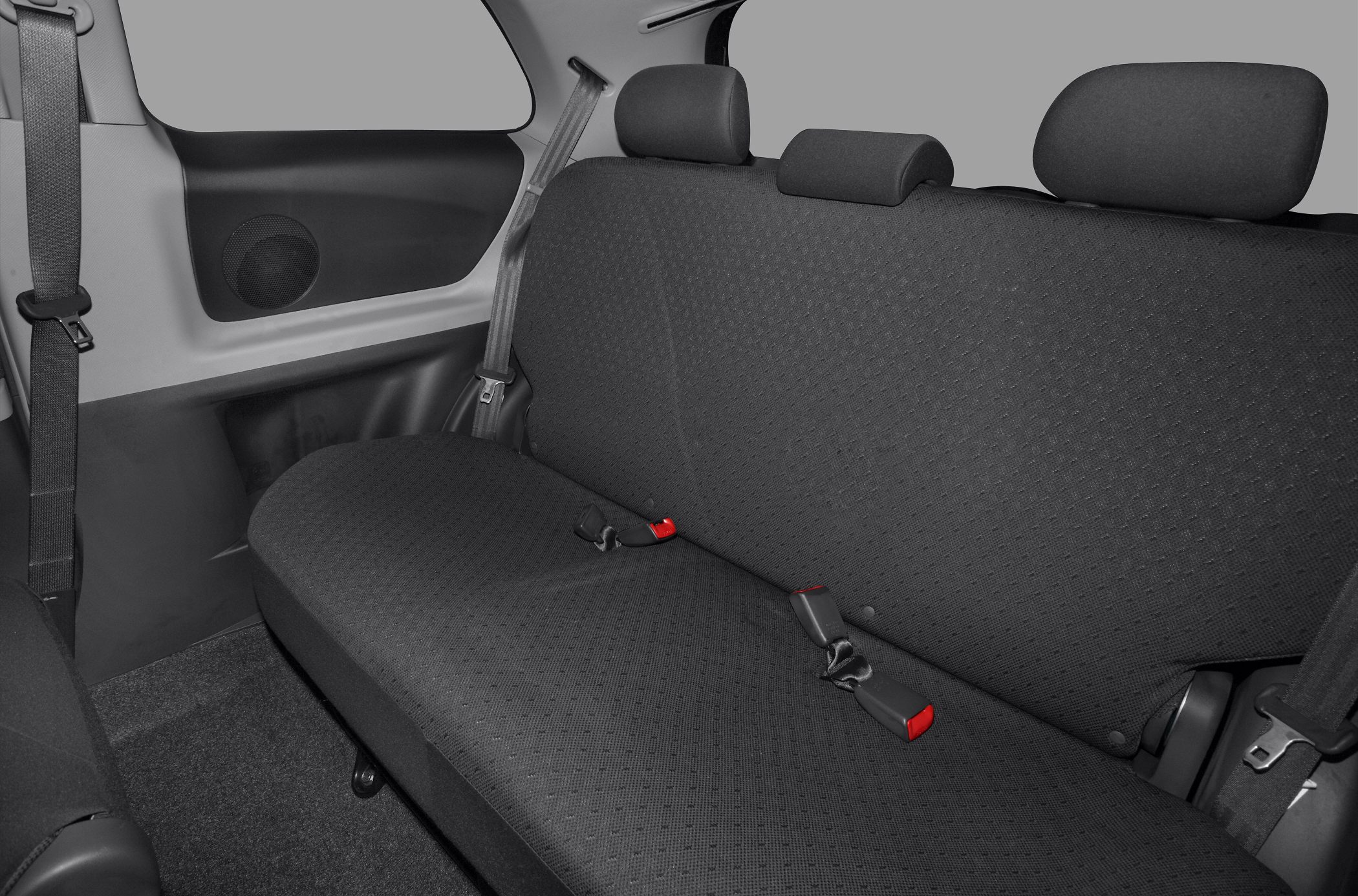 Rear seat with fabric upholstery, seat belts, and headrests