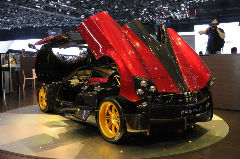 Rear engine and gullwing doors of a luxury performance vehicle
