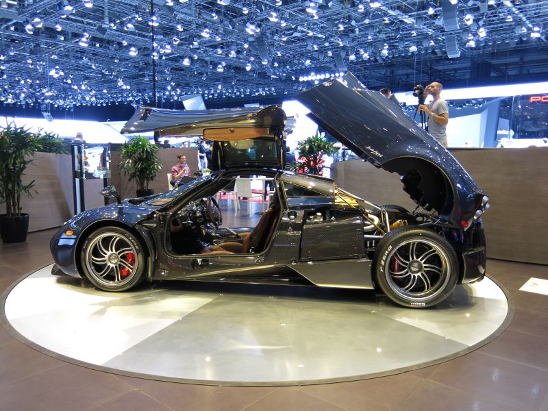 Side view with gullwing doors and rear hood open