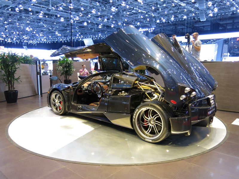 Butterfly doors open and rear hood raised showing engine bay